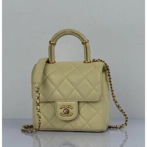 CHANEL Crush Quilted Leather Mini Top Handle Flap Bag in Yellow